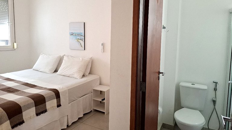 Localização Perfeita! Suítes Aconchegantes à Praia