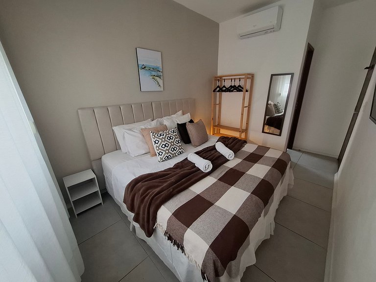 Localização Perfeita! Suítes Aconchegantes à Praia