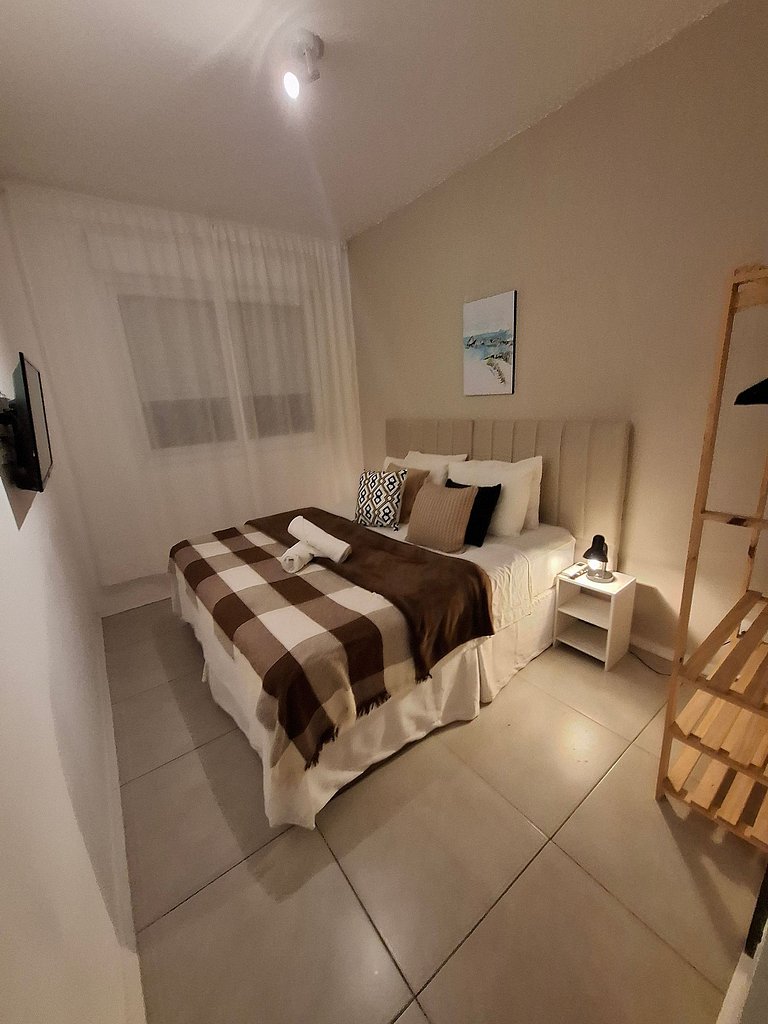 Localização Perfeita! Suítes Aconchegantes à Praia